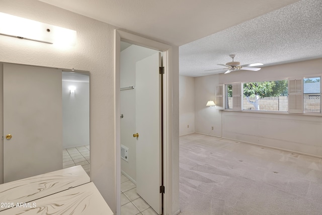 8326 E Valley View Rd, Scottsdale, AZ 85250 - bathroom featuring a ceiling fan, tile patterned floors, and a textured ceiling