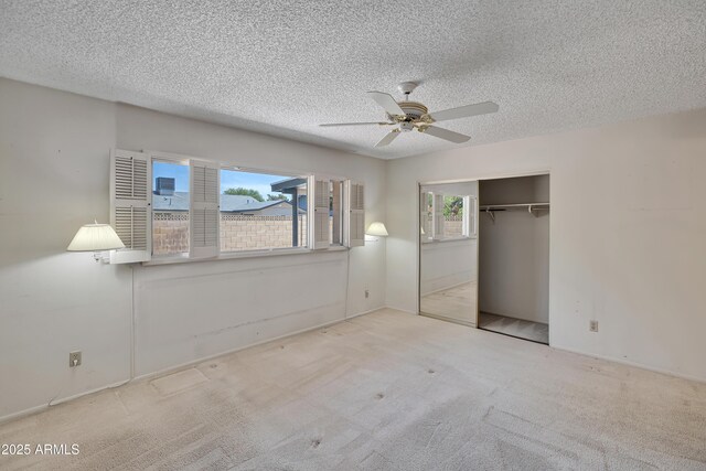 8326 E Valley View Rd, Scottsdale, AZ 85250 - unfurnished bedroom with a closet, a textured ceiling, carpet floors, and a ceiling fan