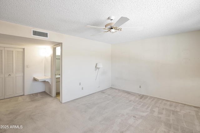 8326 E Valley View Rd, Scottsdale, AZ 85250 - unfurnished bedroom featuring carpet, a textured ceiling, a ceiling fan, and a closet
