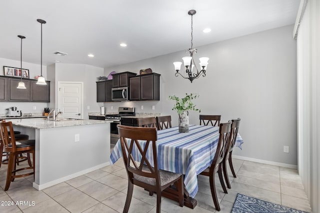 dining area with a chandelier, light tile patterned flooring, visible vents, and recessed lighting