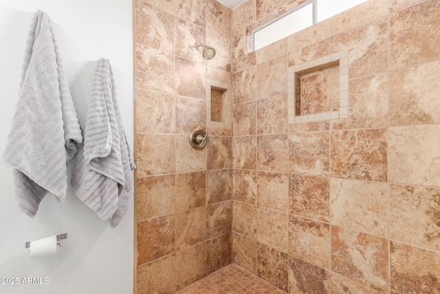 bathroom featuring tiled shower