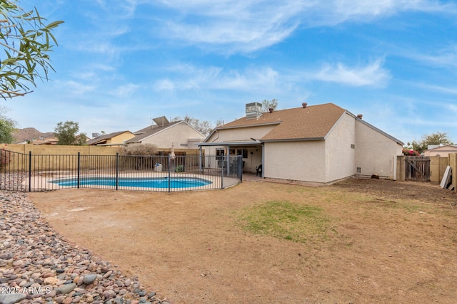 view of pool featuring a patio, a yard, a fenced backyard, and a fenced in pool