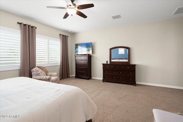 bedroom featuring light carpet and ceiling fan