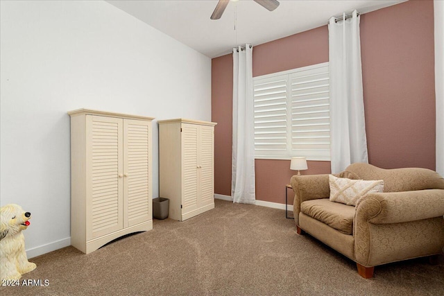 sitting room featuring carpet flooring and ceiling fan