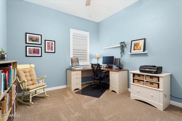 carpeted home office with ceiling fan