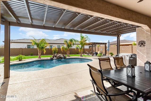 view of pool with a patio area and pool water feature