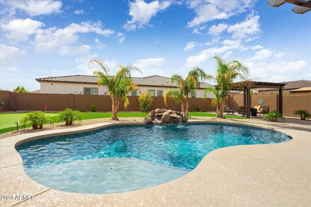 view of swimming pool with a patio area and pool water feature