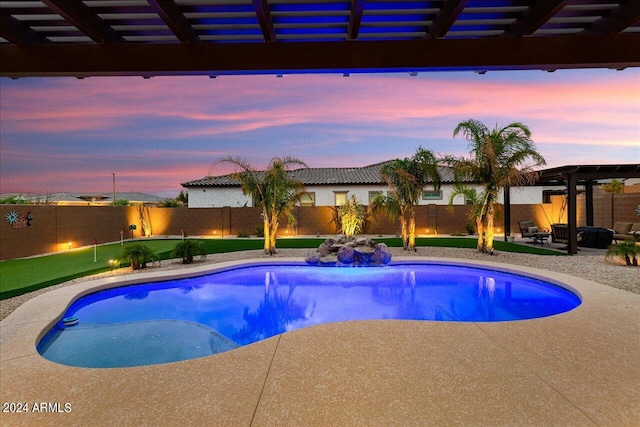 pool at dusk featuring a patio and a pergola