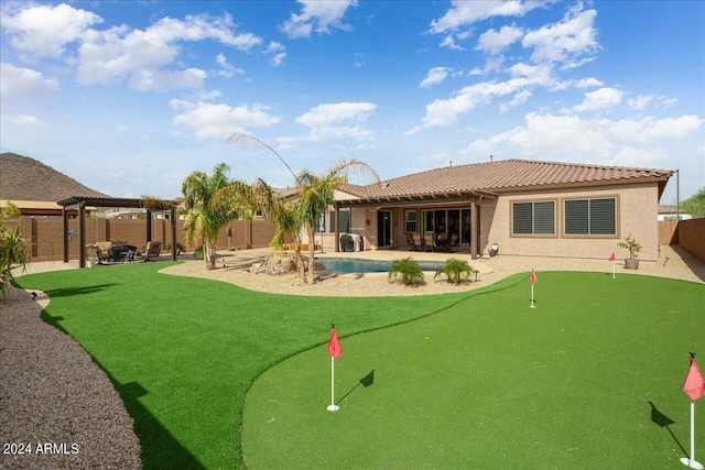 back of house with a patio and a fenced in pool