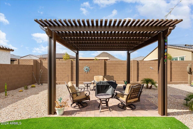 view of patio featuring a pergola