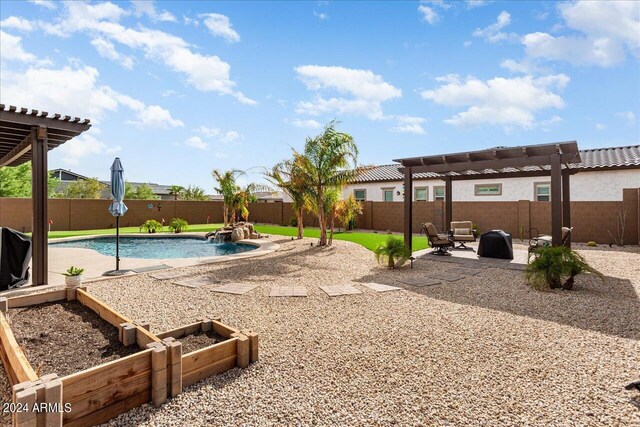 exterior space with a fenced in pool, pool water feature, a patio, and a pergola