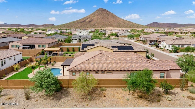 birds eye view of property featuring a mountain view