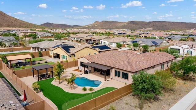 birds eye view of property with a mountain view