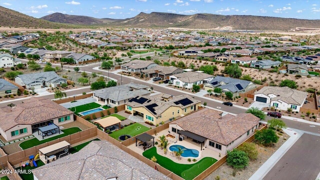 birds eye view of property featuring a mountain view