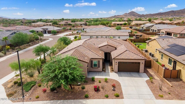 birds eye view of property featuring a mountain view