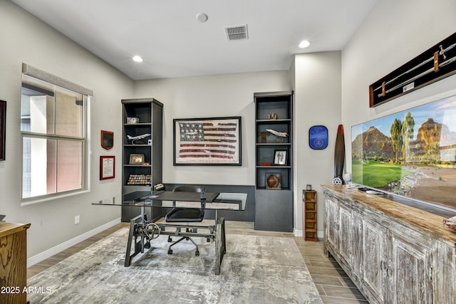 home office with light wood-style flooring, visible vents, baseboards, and recessed lighting