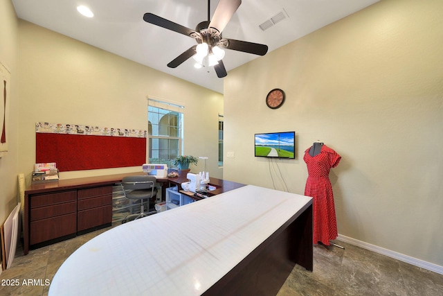 office space with a ceiling fan, visible vents, and baseboards