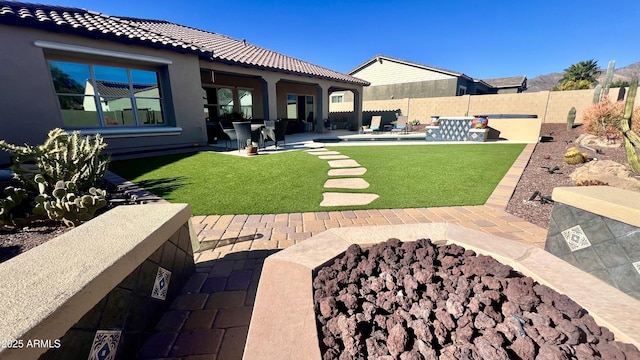 view of yard with a patio area and a fenced backyard