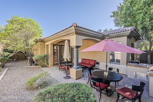 view of patio featuring outdoor lounge area and an outdoor kitchen