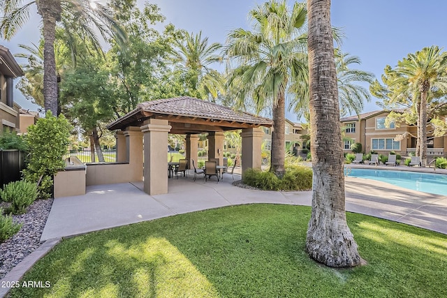 view of patio with a gazebo and a community pool