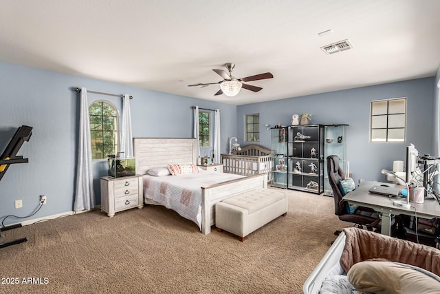 bedroom featuring carpet flooring, visible vents, and a ceiling fan