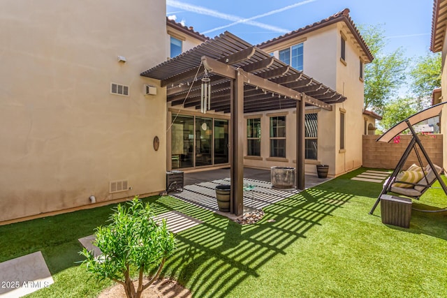 rear view of property with a pergola, stucco siding, fence, and visible vents