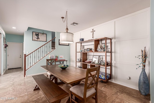 dining area featuring stairs, visible vents, and baseboards