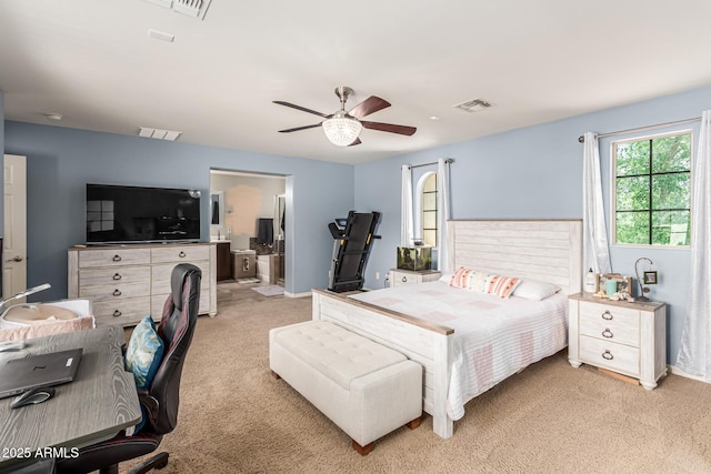 bedroom featuring light carpet, visible vents, and a ceiling fan