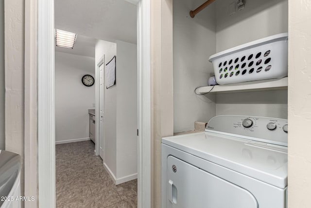 laundry area with washer / dryer