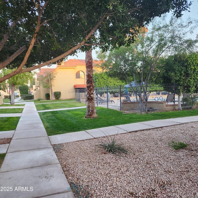 view of community with a lawn