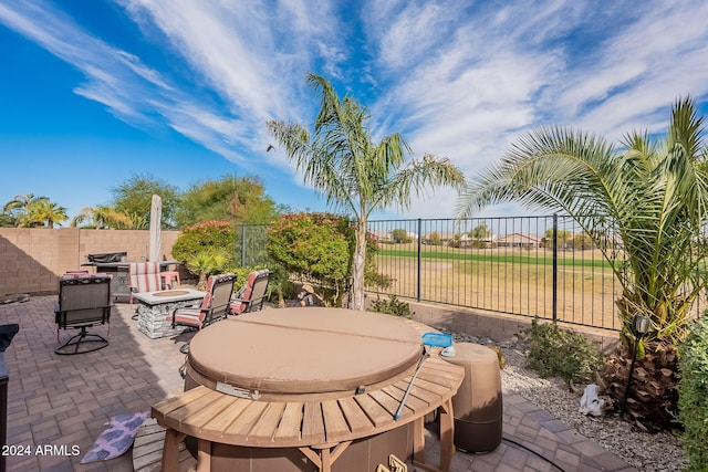 view of patio with an outdoor fire pit