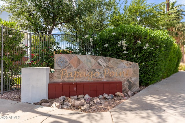 community sign with fence