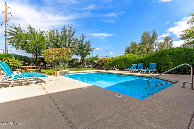 community pool with a patio