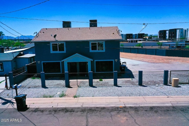 4020 S 15th St, Phoenix, AZ 85040 - view of front of house with a fenced front yard, roof with shingles, and stucco siding