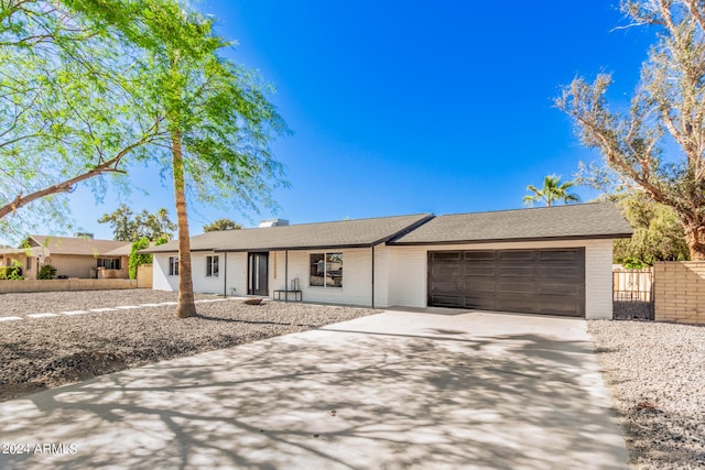 single story home with a garage