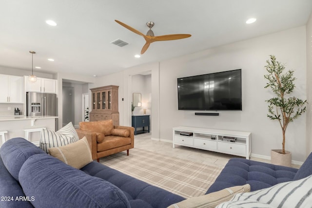 living room with ceiling fan