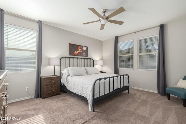 bedroom with light carpet and ceiling fan