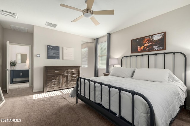 carpeted bedroom featuring ceiling fan and connected bathroom