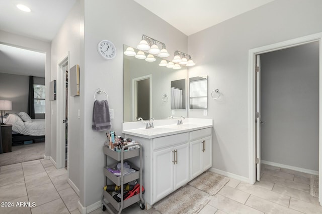 bathroom featuring tile patterned flooring and vanity