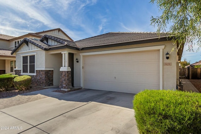 craftsman inspired home with a garage