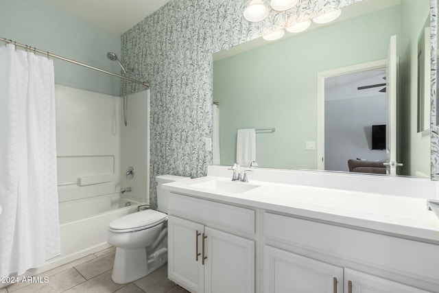 full bathroom with vanity, ceiling fan, shower / bathtub combination with curtain, tile patterned flooring, and toilet