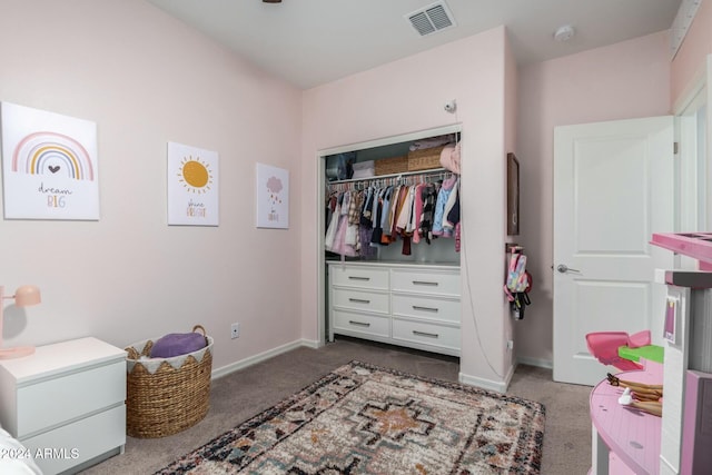 carpeted bedroom featuring a closet