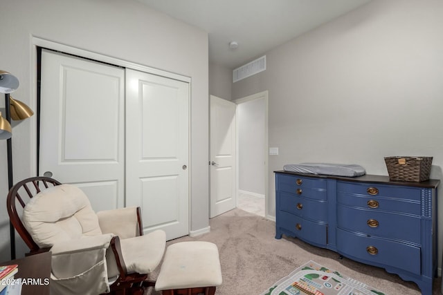 living area featuring light colored carpet