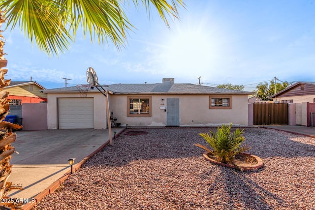 4408 N 29th Ave, Phoenix, AZ 85017 - ranch-style home with a gate, stucco siding, a garage, and concrete driveway