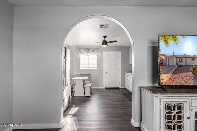 4408 N 29th Ave, Phoenix, AZ 85017 - entryway with arched walkways, dark wood-style flooring, a ceiling fan, and baseboards