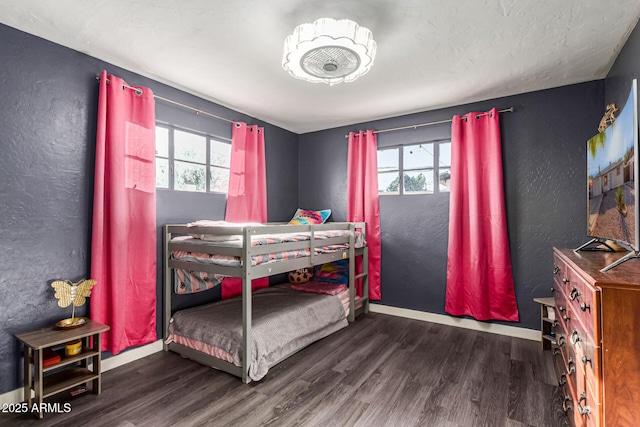 4408 N 29th Ave, Phoenix, AZ 85017 - bedroom with wood finished floors, baseboards, and a textured wall