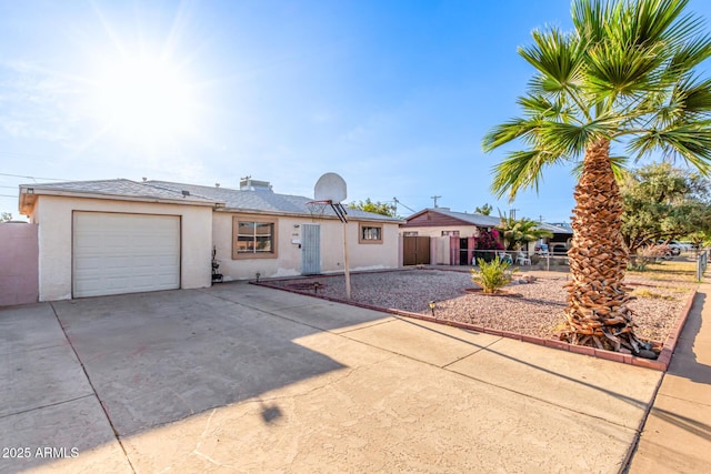 4408 N 29th Ave, Phoenix, AZ 85017 - ranch-style house featuring driveway, stucco siding, and a garage
