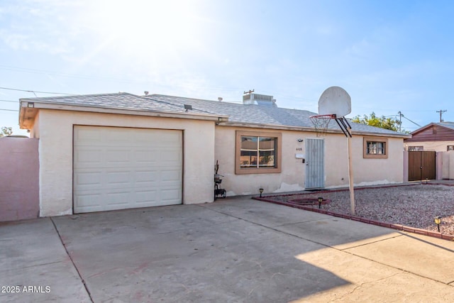 4408 N 29th Ave, Phoenix, AZ 85017 - view of front of home featuring driveway, stucco siding, a garage, and a shingled roof