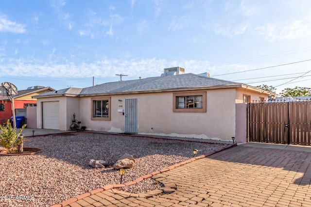 4408 N 29th Ave, Phoenix, AZ 85017 - single story home with stucco siding, an attached garage, and driveway