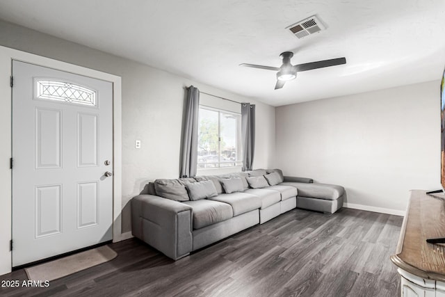 4408 N 29th Ave, Phoenix, AZ 85017 - living area featuring dark wood-style floors, baseboards, and ceiling fan
